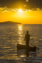 Fisherman in his canoe on Lake Malawi