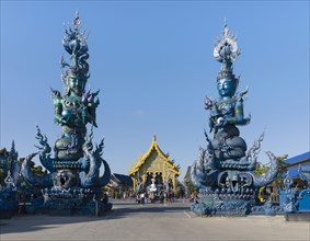 Demons sculptures at the entrance of Wat Rong Seur Ten