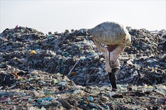 Garbage collector on garbage dump