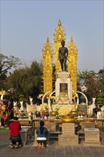 Praying in front of Monument of King Mangrai