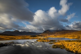 River Ba with mountain peaks of Meall aÂ´Bhuiridh and Clach Leathad in the background and dramatic clouds