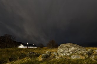 Black Rock Cottage in front of thunderstorm with Glen Coe