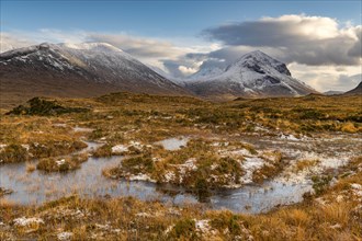 Moor landscape with snow-covered peaks of the Cullins Mountains in Highland Landscape
