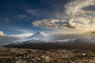 Snowy mountain tops of Ben Lee with clouds in Highland landscape
