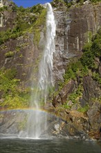 Rainbow over waterfall