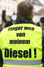 Demonstrator with yellow vest with inscription