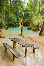 Wooden table in turquoise water