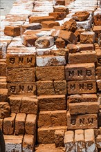 Stacked red bricks