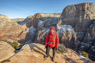 Young woman at the summit of Angels Landing