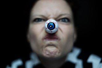 Woman with artificial eye as nose
