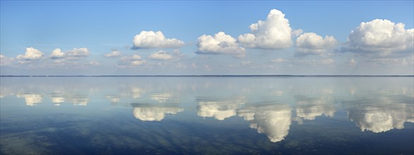 Clouds are reflected in the calm water