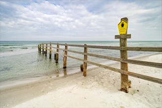 Fence on the beach of the Baltic Sea as border of the closed off core zone of the Western Pomerania Lagoon Area National Park