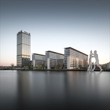 Allianz Tower on the River Spree with the Molecule Man monument by American artist Jonathan Borofsky