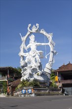 The massive Arjuna statue at the entrance of the town of Ubud