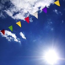 Multicolored pennants with blue sky