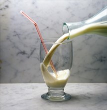 Glass and jar of milk