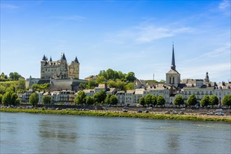 City view with Chateau de Saumur and Saint Pierre church on the banks of the Loire river