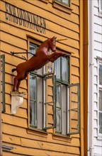 Unicorn on the wall of a historic wooden house