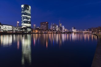 Skyline of Frankfurt from the banks of the Main with the Westhafen Tower