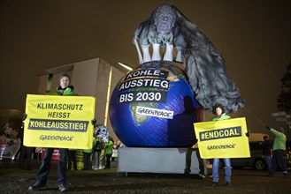 Demonstrators with globe call for coal phase-out by 2030 in protests to the Federal Chancellery for compliance with climate protection targets