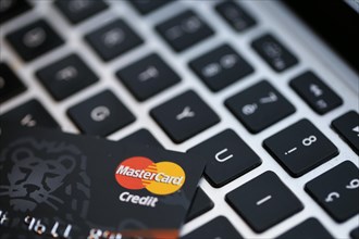Mastercard credit card on a keyboard of a computer