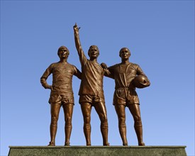 Manchester United Holy Trinity statue outside the Old Trafford stadium