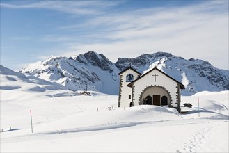 Chapel in a snowy winter landscape