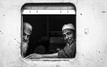 Passengers with a view from a train window