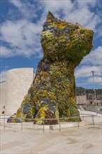 Sculpture Puppy by Jeff Koons in front Guggenheim Museum Bilbao