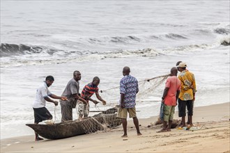 Fishermen prepare a net for fishing