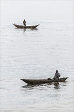 Two fishermen in a pirogue