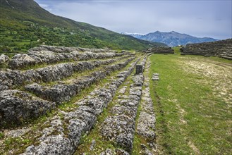 Rows of seats in the stadium of the ruined city of Amantia