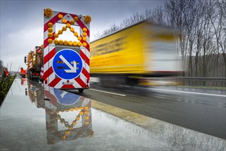 Warning for lane change on a vehicle of the motorway maintenance authorities on the motorway A4 during rain