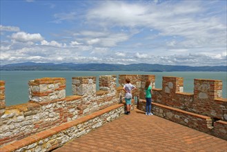 Two children stand on battlements