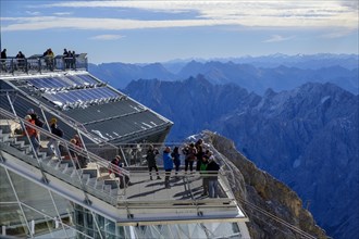 Hikers on the viewing platform of the Bavarian Zugspitzbahn mountain station
