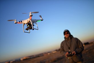 Man flying Phantom Drone outdoors