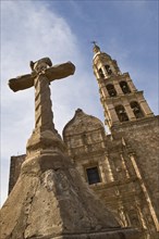 Cross and front of church Nuestra Senora del Rosario in the town of El Rosario