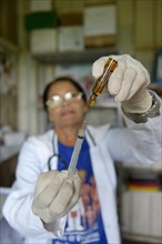 Nurse in a health center prepares a vaccine