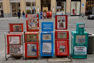 Newspaper stands of various daily newspapers
