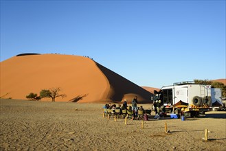 Dune 45 with safari tourists at Namib-Naukluft National Park in the Namib Desert
