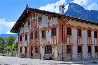 Pilatus house with typical Luftlmalerei in the center with the Kofel 1342m