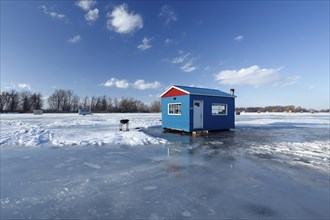 Ice fishing cabin on frozen Saint Lawrence River