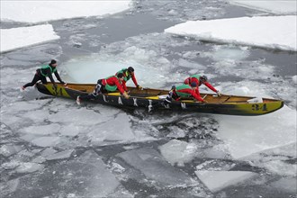 Canoe race challenge over the partly frozen Saint Lawrence River