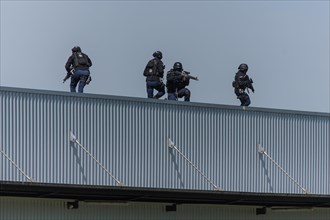 Exercise of special operations group of Lucerne police Luchs with machine guns on roof