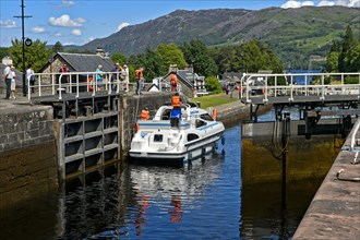 Motorboat passing through lock in Caledonian Canal