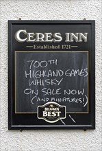 Restaurant sign displaying 700th Highland Games Whiskey