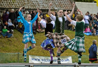 Girls dancing in kilts at the Ceres Highland Games folk dance competition