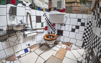 Ladies toilet with ceramic tiles in the public toilet of the artist and architect Friedensreich Hundertwasser
