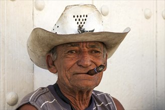 Old cuban man wearing straw hat
