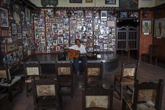 Cuban musician with guitar in a Casa de la Trova